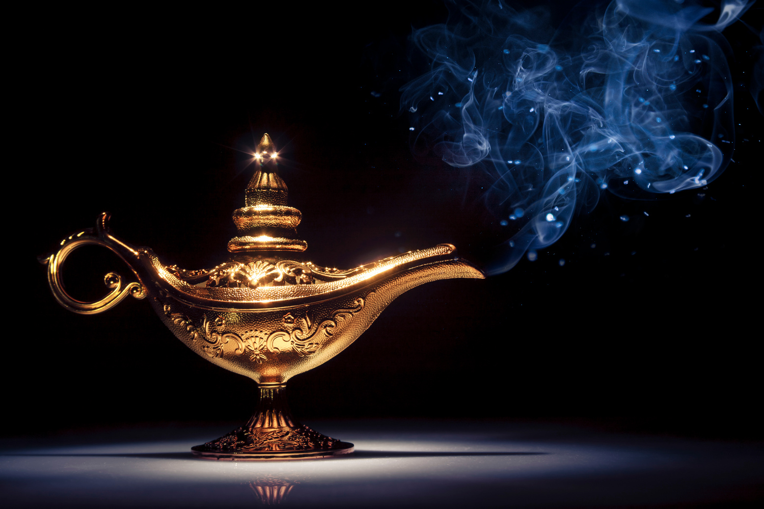 Genie's lamp under a spotlight with smoke coming out